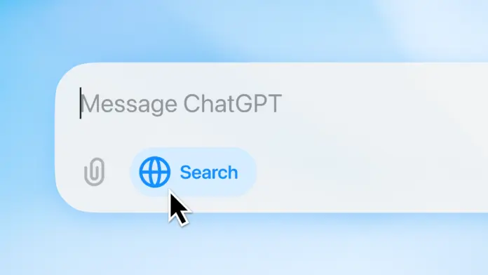 alt="Close-up of a search bar with the text ‘Message ChatGPT’ and a blinking text entry cursor. Below, a globe icon with ‘Search’ is shown, and a cursor hovers over the search button. A paperclip icon is also visible."